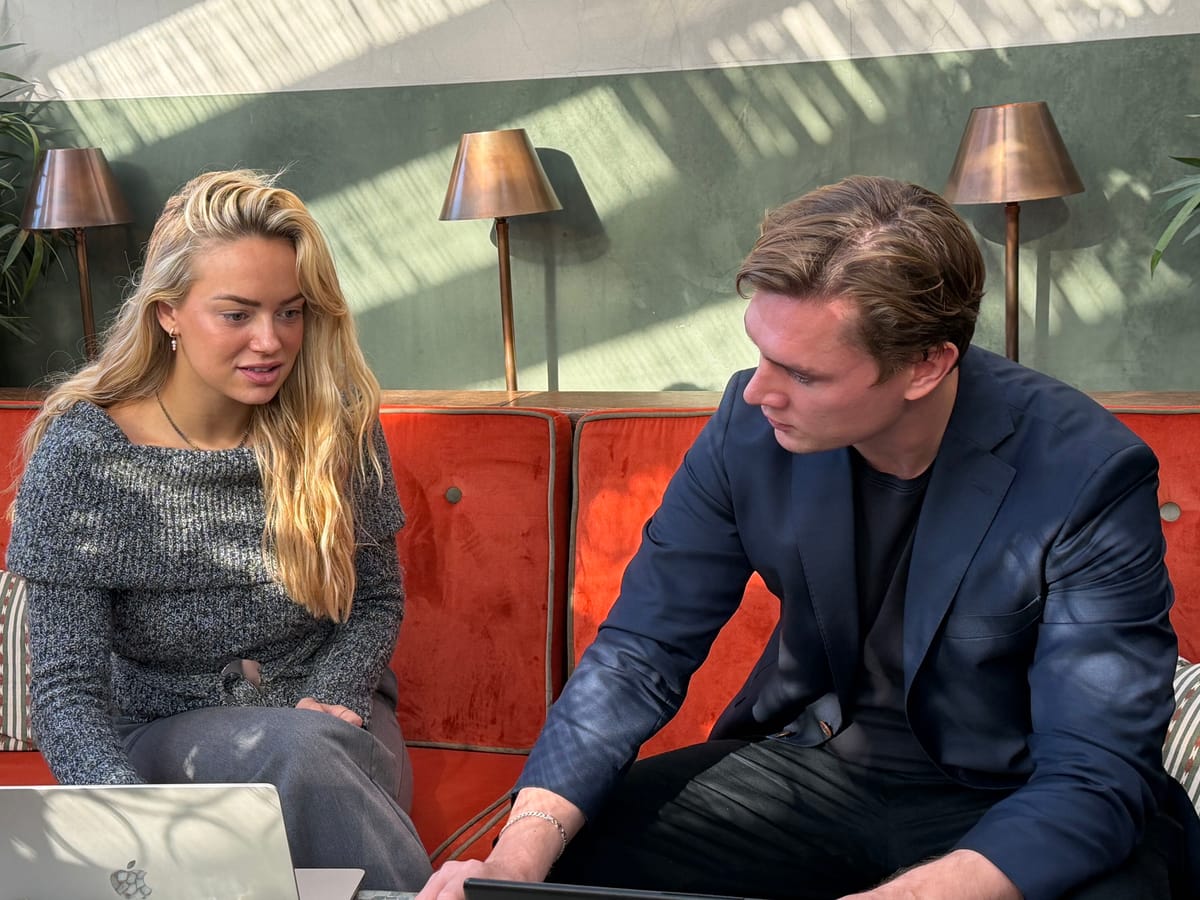 Peter and Laura from the SwayQ team on a sofa in Copenhagen